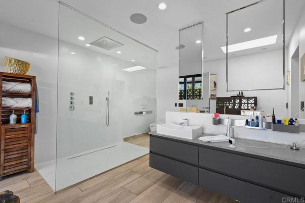 Bathroom, Dual Sink Vanities, Glass Shower, Interior, Recessed Lighting, Wood Texture Flooring