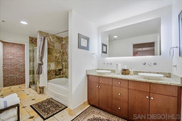 Bathroom, Dual Sink Vanities, Glass Shower, Interior, Recessed Lighting, Stone Walls