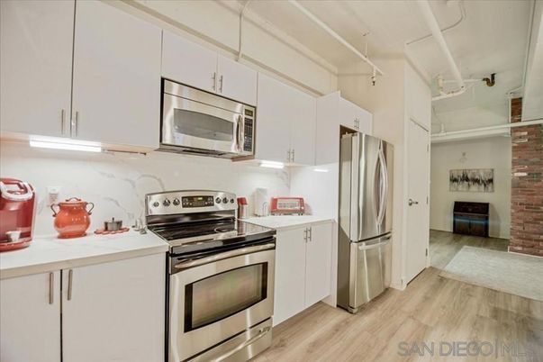 Interior, Kitchen, Marble Walls, Stainless Steel Appliances, Wood Texture Flooring