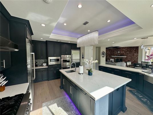 Interior, Kitchen, Pendant Lights, Recessed Lighting, Stainless Steel Appliances, Stone Walls, Wood Texture Flooring