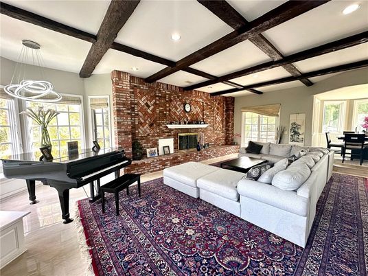 Fireplace, Interior, Living room, Pendant Lights, Piano, Recessed Lighting, Stone Walls, Wooden Beams