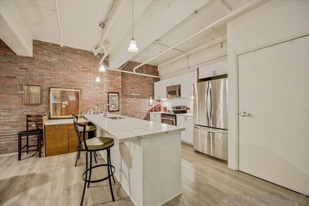 Interior, Kitchen, Pendant Lights, Stainless Steel Appliances, Stone Walls, Wood Texture Flooring