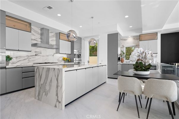 Dining room, Interior, Kitchen, Marble, Marble Walls, Pendant Lights, Recessed Lighting, Stainless Steel Appliances