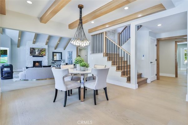 Dining room, Fireplace, Interior, Living room, Pendant Lights, Recessed Lighting, Wooden Beams, Wood Texture Flooring