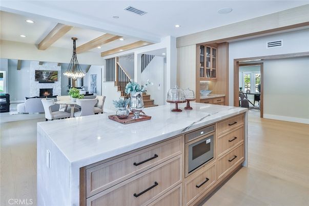 Dining room, Fireplace, Interior, Kitchen, Living room, Pendant Lights, Recessed Lighting, Stainless Steel Appliances, Wooden Beams, Wood Texture Flooring