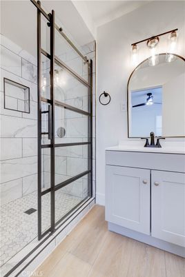 Bathroom, Glass Shower, Interior, Marble Walls, Wood Texture Flooring