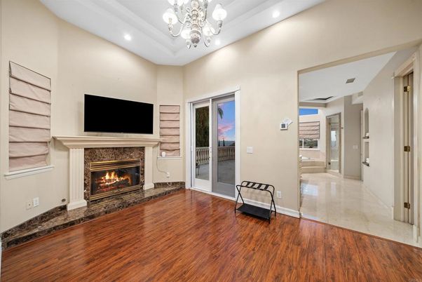 Chandelier, Empty room, Fireplace, Interior, Recessed Lighting, Wood Texture Flooring