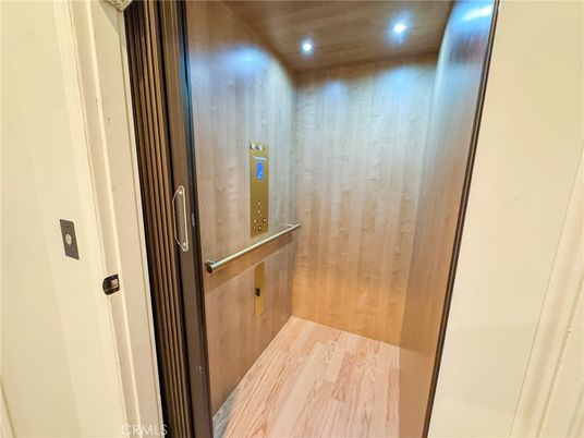 Elevator, Interior, Recessed Lighting, Wooden Ceilings, Wood Texture Flooring, Wooden Walls