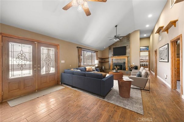 Fireplace, Interior, Living room, Recessed Lighting, Stone Walls, Wood Texture Flooring