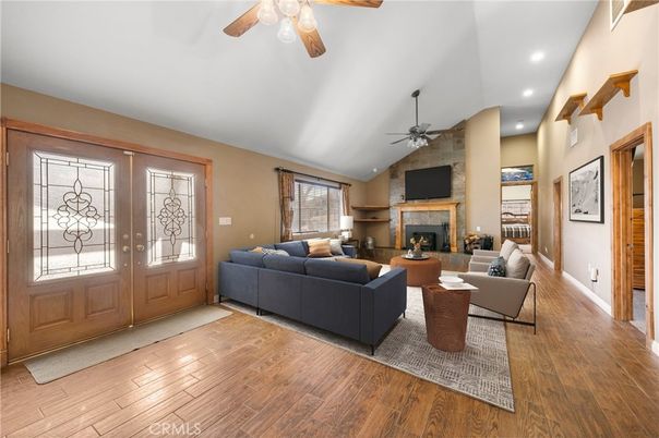 Fireplace, Interior, Living room, Recessed Lighting, Stone Walls, Wood Texture Flooring