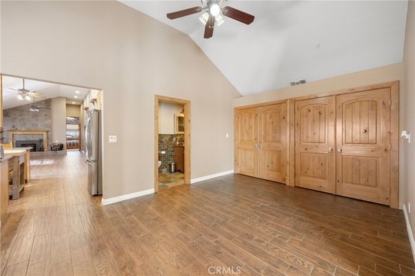 Empty room, Fireplace, Interior, Recessed Lighting, Stone Walls, Wood Texture Flooring