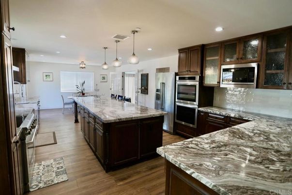 Dining room, Interior, Kitchen, Pendant Lights, Recessed Lighting, Stainless Steel Appliances, Wood Texture Flooring