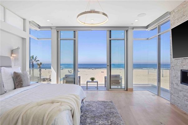 Bedroom, Fireplace, Interior, Pendant Lights, Recessed Lighting, Water, Wood Texture Flooring