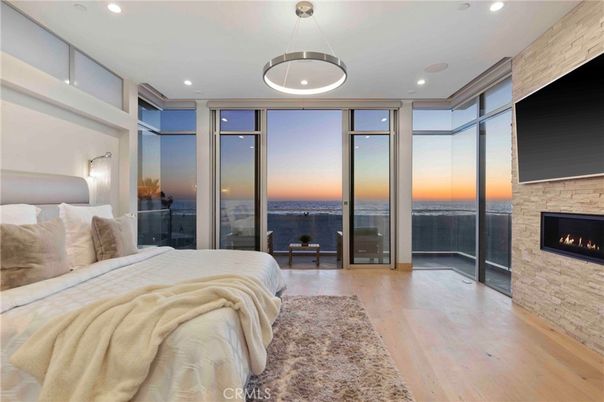 Bedroom, Fireplace, Interior, Pendant Lights, Recessed Lighting, Water, Wood Texture Flooring