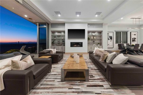 Dining room, Fireplace, Interior, Living room, Pendant Lights, Recessed Lighting, Water, Wood Texture Flooring