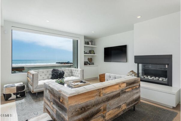 Fireplace, Interior, Living room, Recessed Lighting, Water, Wood Texture Flooring