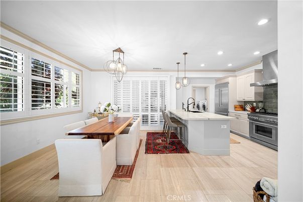 Chandelier, Dining room, Interior, Kitchen, Pendant Lights, Recessed Lighting, Stainless Steel Appliances, Wood Texture Flooring