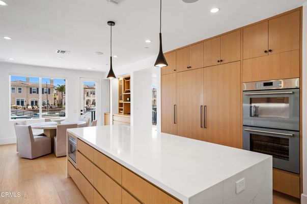 Dining room, Interior, Kitchen, Pendant Lights, Recessed Lighting, Stainless Steel Appliances, Wood Texture Flooring