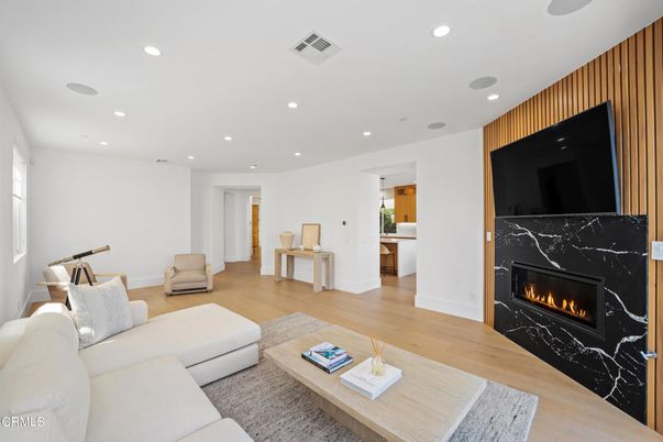 Fireplace, Interior, Living room, Marble Walls, Recessed Lighting, Wood Texture Flooring