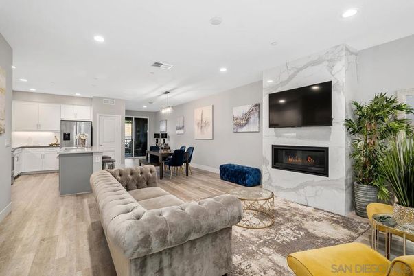 Dining room, Fireplace, Interior, Kitchen, Living room, Pendant Lights, Recessed Lighting, Stainless Steel Appliances, Wood Texture Flooring