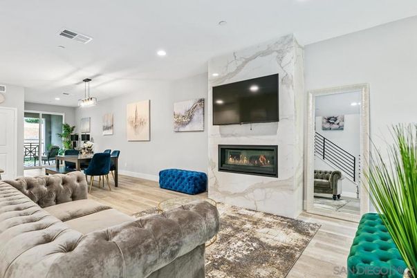Dining room, Fireplace, Interior, Living room, Marble Walls, Pendant Lights, Recessed Lighting, Wood Texture Flooring