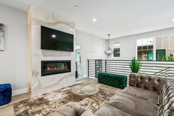 Fireplace, Interior, Living room, Marble Walls, Pendant Lights, Recessed Lighting, Wood Texture Flooring