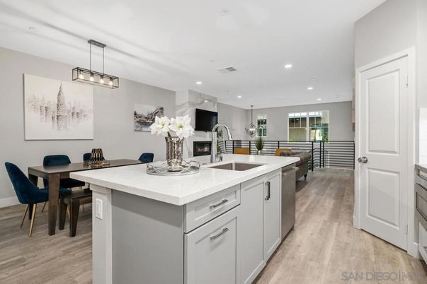 Dining room, Fireplace, Interior, Kitchen, Pendant Lights, Recessed Lighting, Stainless Steel Appliances, Wood Texture Flooring