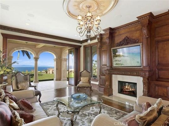 Chandelier, Fireplace, Interior, Living room, Recessed Lighting, Water, Wooden Walls