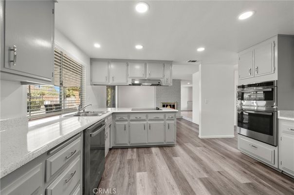 Fireplace, Interior, Kitchen, Recessed Lighting, Stainless Steel Appliances, Wood Texture Flooring