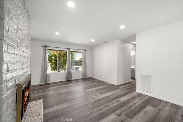 Empty room, Fireplace, Interior, Recessed Lighting, Stone Walls, Wood Texture Flooring