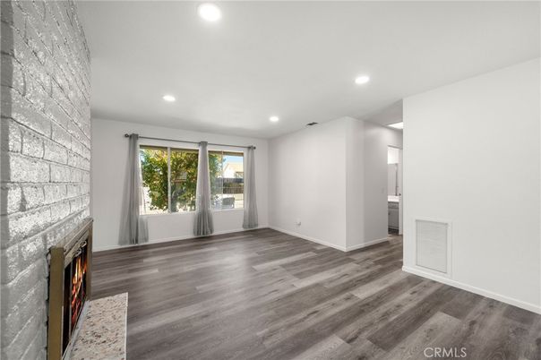 Empty room, Fireplace, Interior, Recessed Lighting, Stone Walls, Wood Texture Flooring