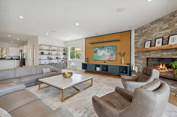 Fireplace, Interior, Living room, Recessed Lighting, Stone Walls, Wood Texture Flooring