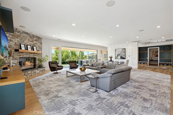 Fireplace, Interior, Living room, Recessed Lighting, Stone Walls, Wood Texture Flooring