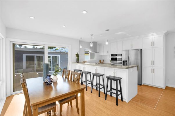 Dining room, Interior, Kitchen, Pendant Lights, Recessed Lighting, Stainless Steel Appliances, Wood Texture Flooring