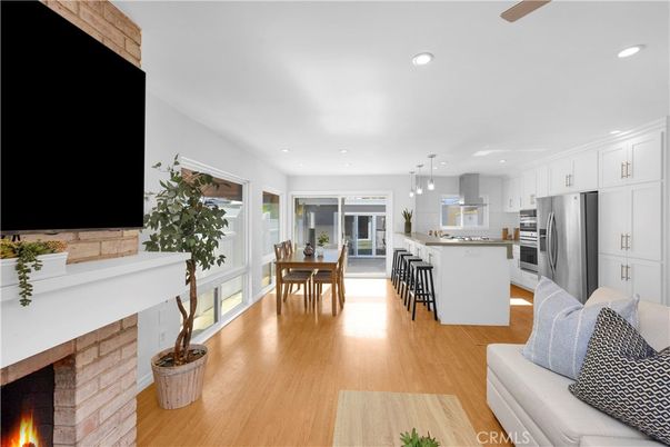 Dining room, Fireplace, Interior, Kitchen, Pendant Lights, Recessed Lighting, Stainless Steel Appliances, Wood Texture Flooring