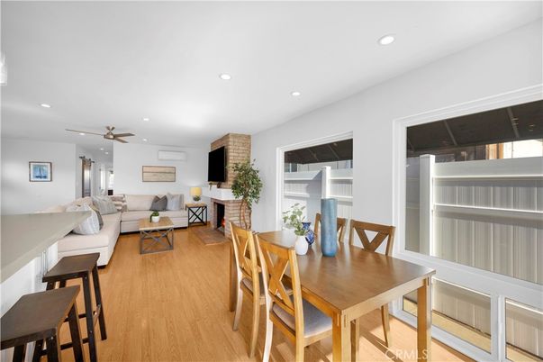 Dining room, Fireplace, Interior, Living room, Recessed Lighting, Wood Texture Flooring