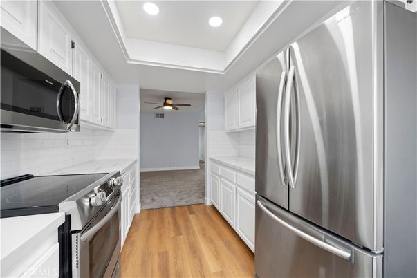 Interior, Kitchen, Recessed Lighting, Stainless Steel Appliances, Wood Texture Flooring