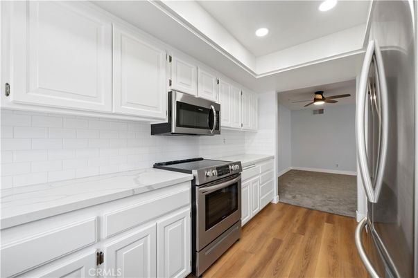 Interior, Kitchen, Recessed Lighting, Stainless Steel Appliances, Wood Texture Flooring