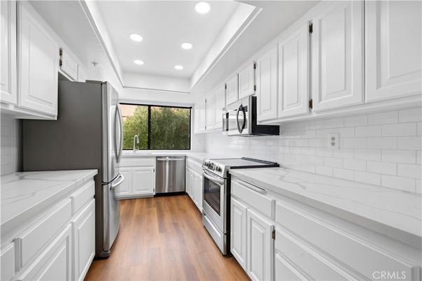 Interior, Kitchen, Recessed Lighting, Stainless Steel Appliances, Wood Texture Flooring