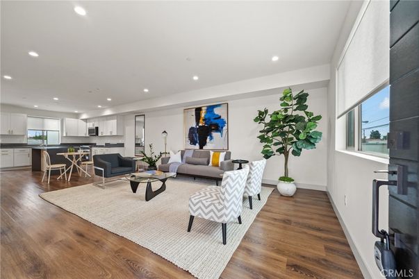 Dining room, Interior, Kitchen, Living room, Recessed Lighting, Stainless Steel Appliances, Wood Texture Flooring