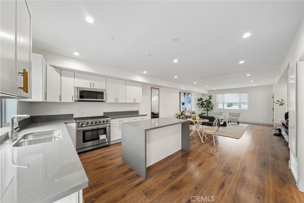 Dining room, Interior, Kitchen, Recessed Lighting, Stainless Steel Appliances, Wood Texture Flooring