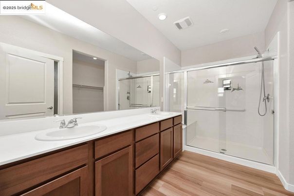 Bathroom, Dual Sink Vanities, Glass Shower, Interior, Recessed Lighting, Wood Texture Flooring