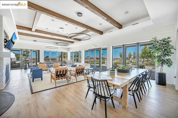 Dining room, Fireplace, Interior, Living room, Recessed Lighting, Water, Wooden Beams, Wood Texture Flooring