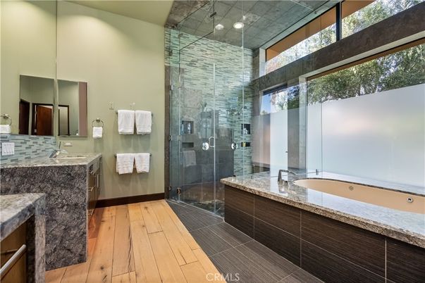 Bathroom, Dual Sink Vanities, Glass Shower, Interior, Recessed Lighting, Wood Texture Flooring