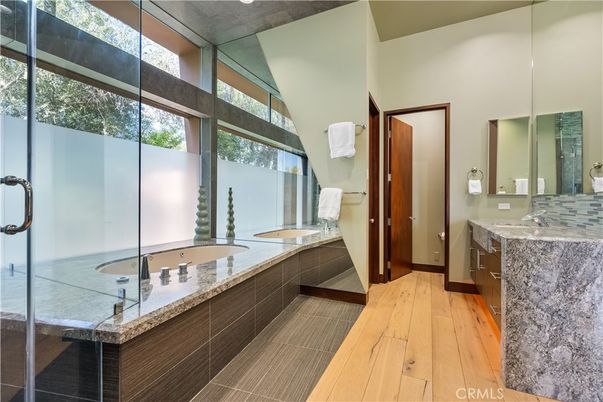 Bathroom, Dual Sink Vanities, Glass Shower, Interior, Wood Texture Flooring