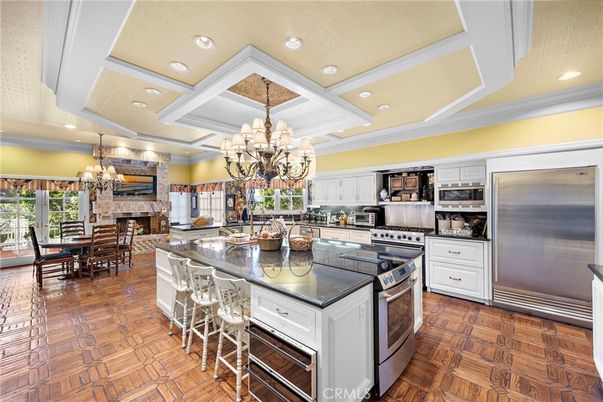 Chandelier, Dining room, Fireplace, Interior, Kitchen, Recessed Lighting, Stainless Steel Appliances