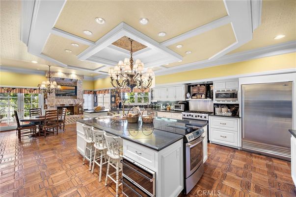 Chandelier, Dining room, Fireplace, Interior, Kitchen, Recessed Lighting, Stainless Steel Appliances