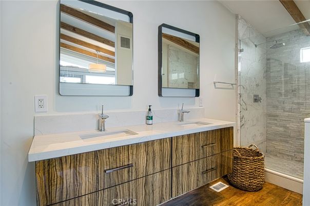 Bathroom, Dual Sink Vanities, Glass Shower, Interior, Marble Walls, Wood Texture Flooring