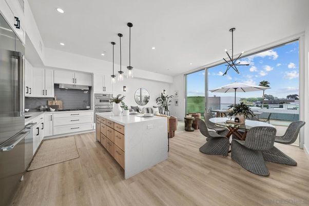 Dining room, Interior, Kitchen, Pendant Lights, Recessed Lighting, Stainless Steel Appliances, Wood Texture Flooring