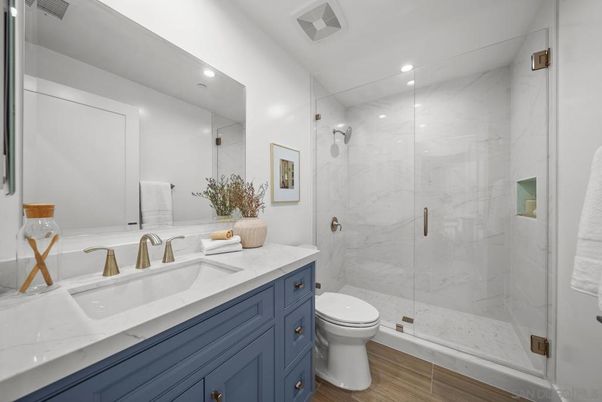 Bathroom, Glass Shower, Interior, Marble Walls, Recessed Lighting, Wood Texture Flooring